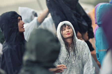 BONTIDA, ROMANIA - JULY 16, 2016: People living heavy rainy days at Electric Castle Festival. After 3 days of raining the area of the festival became extremly muddy and wetのeditorial素材