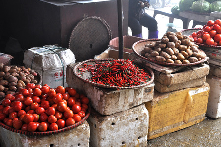 SAPA, VIETNAM - FEBRUARY 22, 2013: Unidentified people selling fresh fruits and vegetables in the rural market of Sapa, Northern Vietnamのeditorial素材