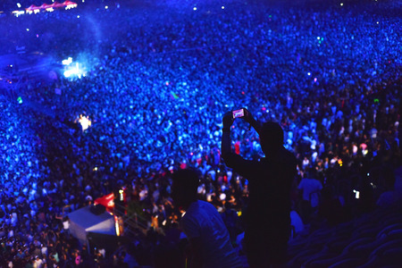 CLUJ-NAPOCA, ROMANIA - AUGUST 7, 2016: Large crowd of people, audience partying in the front of the Main Stage at a Armin van Buuren concert at Untold Festivalのeditorial素材