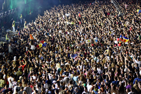 CLUJ-NAPOCA, ROMANIA - AUGUST 7, 2016: Large crowd of people, audience partying in the front of the Main Stage at a Armin van Buuren concert at Untold Festivalのeditorial素材