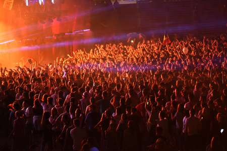 CLUJ NAPOCA, ROMANIA - AUGUST 5, 2016: Crowd of people, audience partying in the front of the stage at a Dannic live mixing concert at Untold festivalのeditorial素材