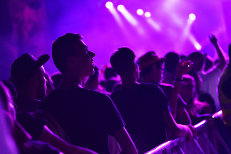 CLUJ-NAPOCA, ROMANIA - AUGUST 8, 2016: Crowd of people partying with raised arms and hands at a Afrojack concert during the Untold Festivalのeditorial素材