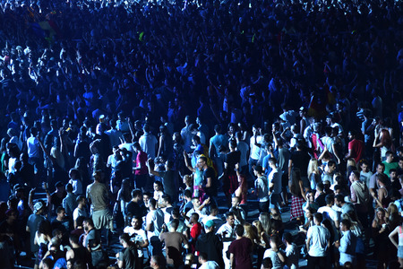 CLUJ-NAPOCA, ROMANIA - AUGUST 5, 2016: Crowd of people, audience with raised hands partying during a Dj Hardwell concert at Untold Festivalのeditorial素材
