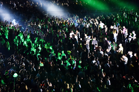 CLUJ-NAPOCA, ROMANIA - AUGUST 5, 2016: Crowd of people, audience with raised hands partying during a Dj Hardwell concert at Untold Festivalのeditorial素材