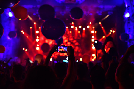 CLUJ-NAPOCA, ROMANIA - AUGUST 6, 2016: People taking photos with smart phones at a Dj Twoloud live concert at Untold festivalのeditorial素材