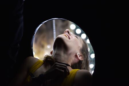 CLUJ-NAPOCA, ROMANIA - AUGUST 6, 2016: Woman tries the Mirror Trip Box at the Untold Festivalのeditorial素材