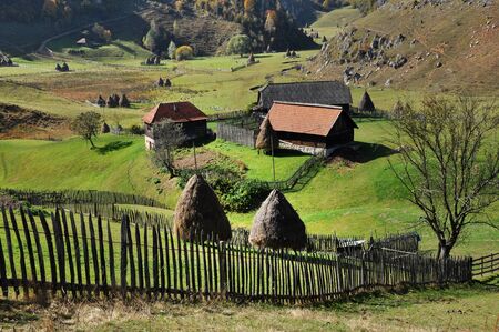 Autumn in the mountains. Rural countryside farmlandの写真素材