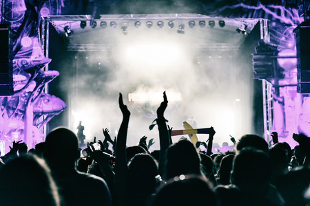 Concert crowd applauding at a music festivalの写真素材