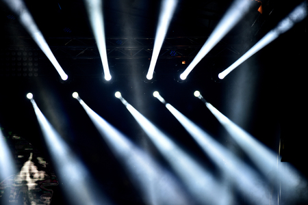 Stage lights. Light projectors in the darkの写真素材