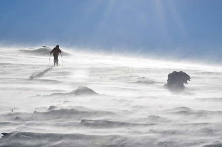 Backcountry skier woman touring in beautiful winter mountainsの写真素材