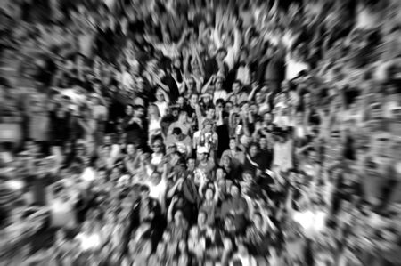 Blurred background of crowd of people in a stadium at a footbal matchの写真素材
