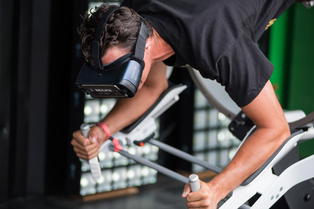 BONTIDA, ROMANIA - JULY 14, 2017: A guy using Samsung virtual reality headset. Man playing with a VR oculus googles at Electric Castle festival tech zoneのeditorial素材