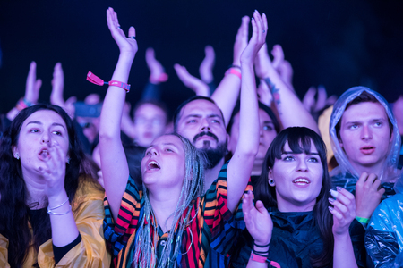BONTIDA, ROMANIA - JULY 15, 2017: Crowd of cheering people enjoying a concert performed by...