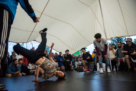 BONTIDA, ROMANIA - JULY 15, 2017: B-boy doing some break dance tricks in the hip hop tent at Electric Castle festivalのeditorial素材