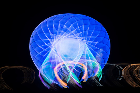 Blurred giant wheel, ferris photographed with long exposure technique at night. Motion blur
