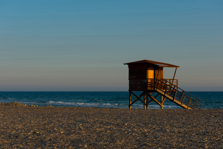 Baywatch tower on the beach. Lifeguard tower in the sunsetの写真素材