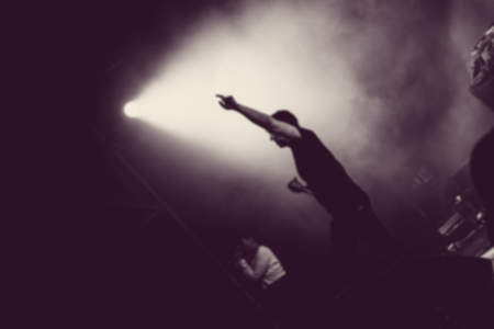 Artist in stage lights. Blurred image
