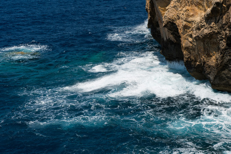 Rocky coastline and sea. Blue hole and the collapsed Azure window in Dwejra Bay, Gozo, Maltaの写真素材