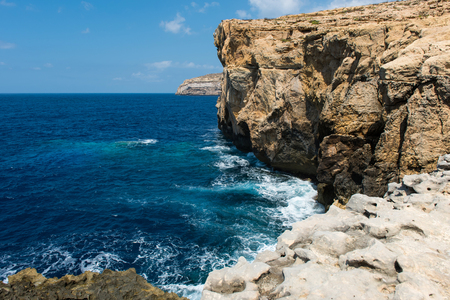 Rocky coastline and sea. Blue hole and the collapsed Azure window in Dwejra Bay, Gozo, Maltaの写真素材