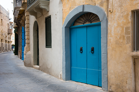Narrow Mediterranean alleyway in the medieval city of Mosta, Maltaの写真素材