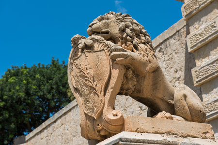 Statue of a lion at the entrance in Mdina silent city fortification, Maltaの写真素材