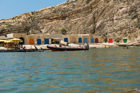 DWEJRA, MALTA - AUGUST 22, 2017: The Inland Sea (Qawra, Dwejra), is a lagoon of seawater on the island of Gozo linked to the Mediterranean Sea through an opening formed by a narrow natural archのeditorial素材