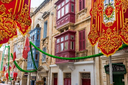 VALLETTA, MALTA - AUGUST 23, 2017: The Feast of St. Dominic is celebrated in the town of Vittoriosa (Birgu) in Malta. The streets are ornated with religious flagsのeditorial素材