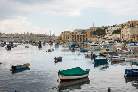 VALLETTA, MALTA - AUGUST 23, 2017: Boats, ships and yachts anchoring in Birgu harbor, one of the biggest port from the Three Cities of Maltaのeditorial素材