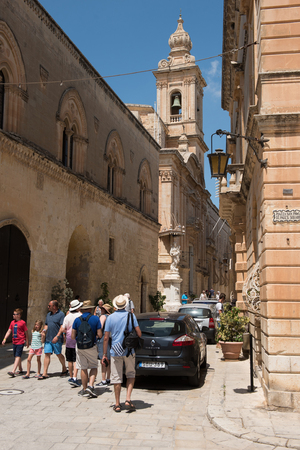 MDINA, MALTA - AUGUST 21, 2017: Tourists visiting the beautiful Silent city of Mdina.  Mdina is one of Game of Thrones movie HBO filming locations in Maltaのeditorial素材