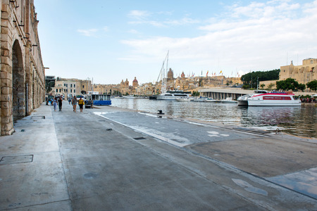 VALLETTA, MALTA - AUGUST 23, 2017: Boats, ships and yachts anchoring in Birgu harbor, one of the biggest port from the Three Cities of Maltaのeditorial素材