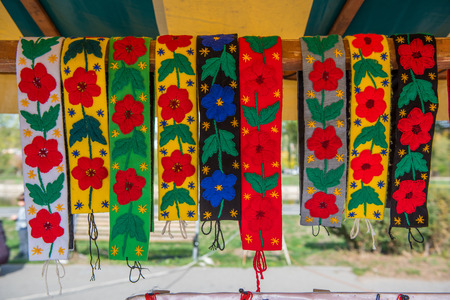 Traditional Romanian clothe accessories. Colorful pattern of skirt riband, stingの写真素材