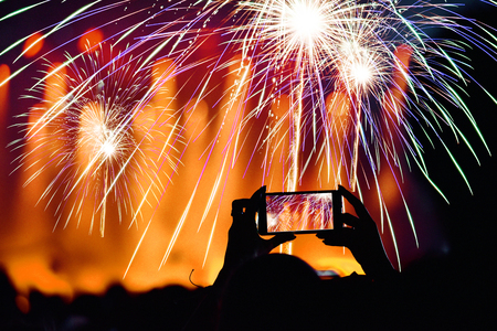 Cheerful crowd and fireworks. New Year conceptの写真素材
