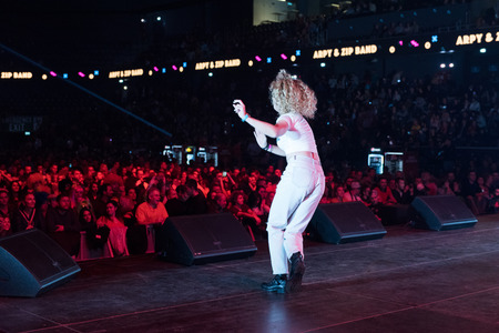 CLUJ NAPOCA, ROMANIA - NOVEMBER 19, 2017: Dancer from a local dance group warm up the crowd on the stage at We Love Retro Partyのeditorial素材