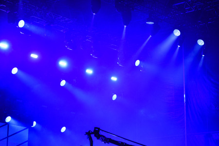 Blue stage lights during a rock concertの写真素材
