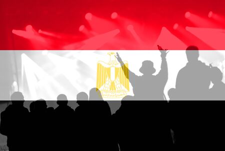 Crowd of football, soccer fans with raised arms with blending Egypt flagの写真素材