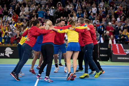 CLUJ NAPOCA, ROMANIA - FEBRUARY 11, 2018: Woman tennis players of Romania celebrating the victory after they won the tennis Fed Cup against Canada, general score 3:1のeditorial素材