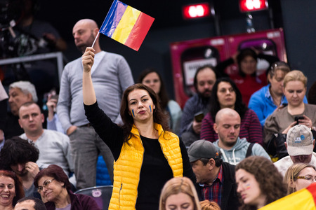 CLUJ NAPOCA, ROMANIA - FEBRUARY 11, 2018: Crowd of people, Romanian tennis fans supporting and applauding in the tribune, during a Fed Cup tennis match between Romania and Canadaのeditorial素材