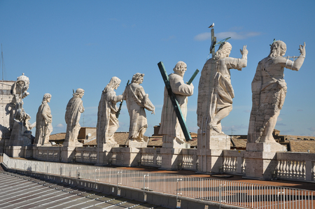 The roof of Maderno's Facade of Saint Peter's Basilica, features statues of Jesus and 11 of the Apostles along with John the Baptist. Vatican cityの写真素材
