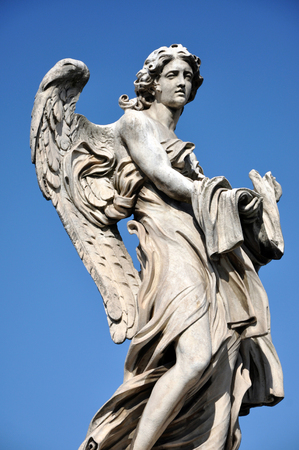 Statue of an Angel with the Garment and Dice. Sant'Angelo bridge, Rome, Italyの写真素材