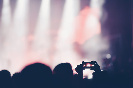 Crowd of people recording live concert with smart phonesの写真素材