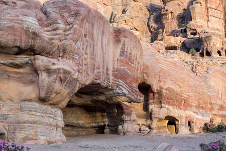 Entrance of a cave, royal tomb in Petra, Jordan. Underground ancient rock carving, used as burial placeの写真素材