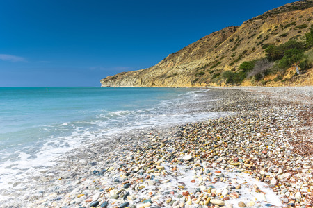 Idyllic calm tropical beach with turquoise sea water and pebble stonesの写真素材