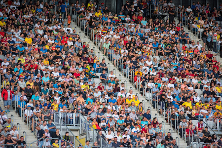 CLUJ, ROMANIA - JUNE 16, 2018: Crowd of people, soccer fans in the tribune supporting their favorites at a match between Romania Golden Team and Barcelona Legendsのeditorial素材
