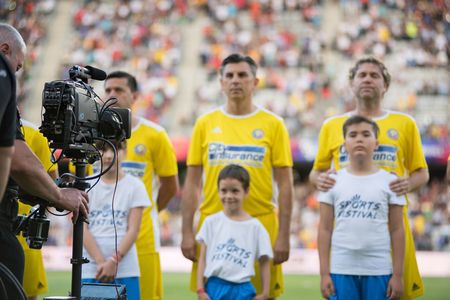 CLUJ, ROMANIA - JUNE 16, 2018: Football players of Romania Golden Team and Barcelona Legends entering the playfield at the beginning of a friendly soccer matchのeditorial素材