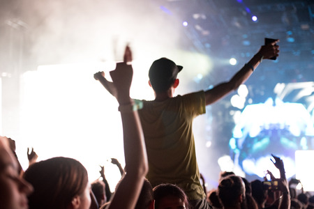 BONTIDA, ROMANIA - JULY 21,  2018: Crowd of partying people dancing during a Dj Excision live set at Electric Castle festivalのeditorial素材