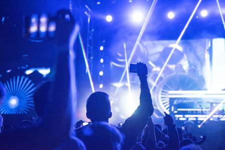 BONTIDA, ROMANIA - JULY 21,  2018: Crowd of partying people dancing during a Dj Excision live set at Electric Castle festivalのeditorial素材