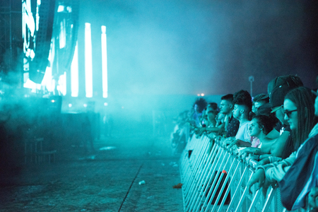BONTIDA, ROMANIA - JULY 21,  2018: Crowd of partying people dancing during a Dj Excision live set at Electric Castle festivalのeditorial素材