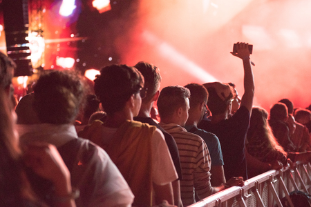 BONTIDA, ROMANIA - JULY 21,  2018: Crowd of partying people dancing during a Dj Excision live set at Electric Castle festivalのeditorial素材