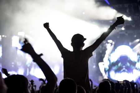BONTIDA, ROMANIA - JULY 21,  2018: Crowd of partying people dancing during a Dj Excision live set at Electric Castle festivalのeditorial素材