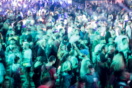 BONTIDA, ROMANIA - JULY 20, 2018: Crowd partying at Electrical Castle music festival. Long exposure, motion blur on peopleのeditorial素材